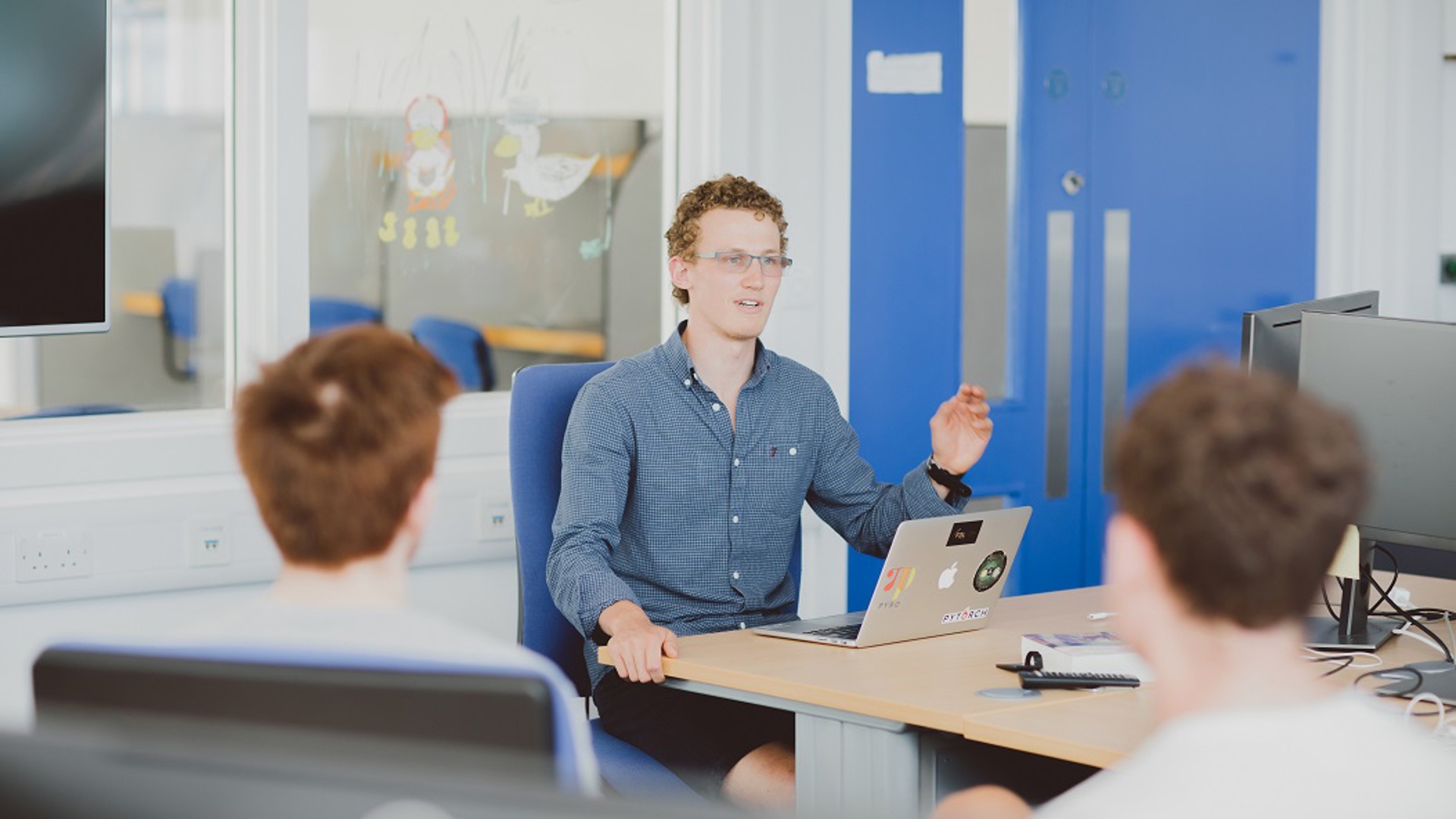 Researchers in classroom at Oxford's Deparment of Engineering Science